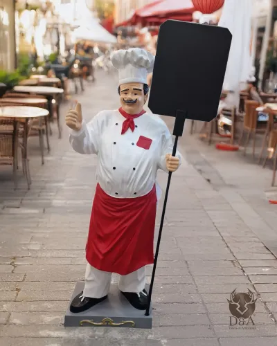 Estatua de un cocinero feliz con tabla de pizza XXL